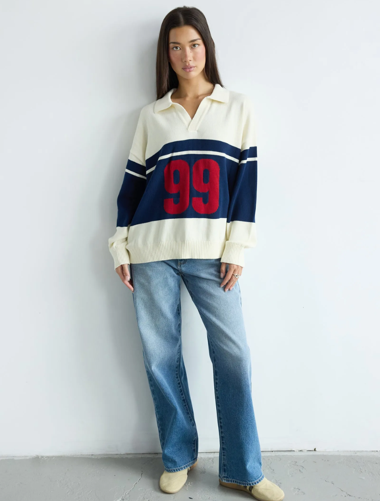Blue striped rugby knit sweater featuring a classic design and comfortable fit.