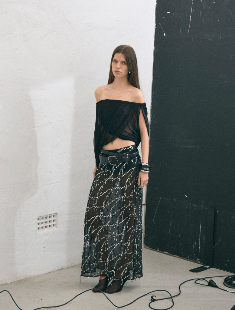 Elegant black maxi skirt with a bias cut, designed for a flattering fit and graceful movement.