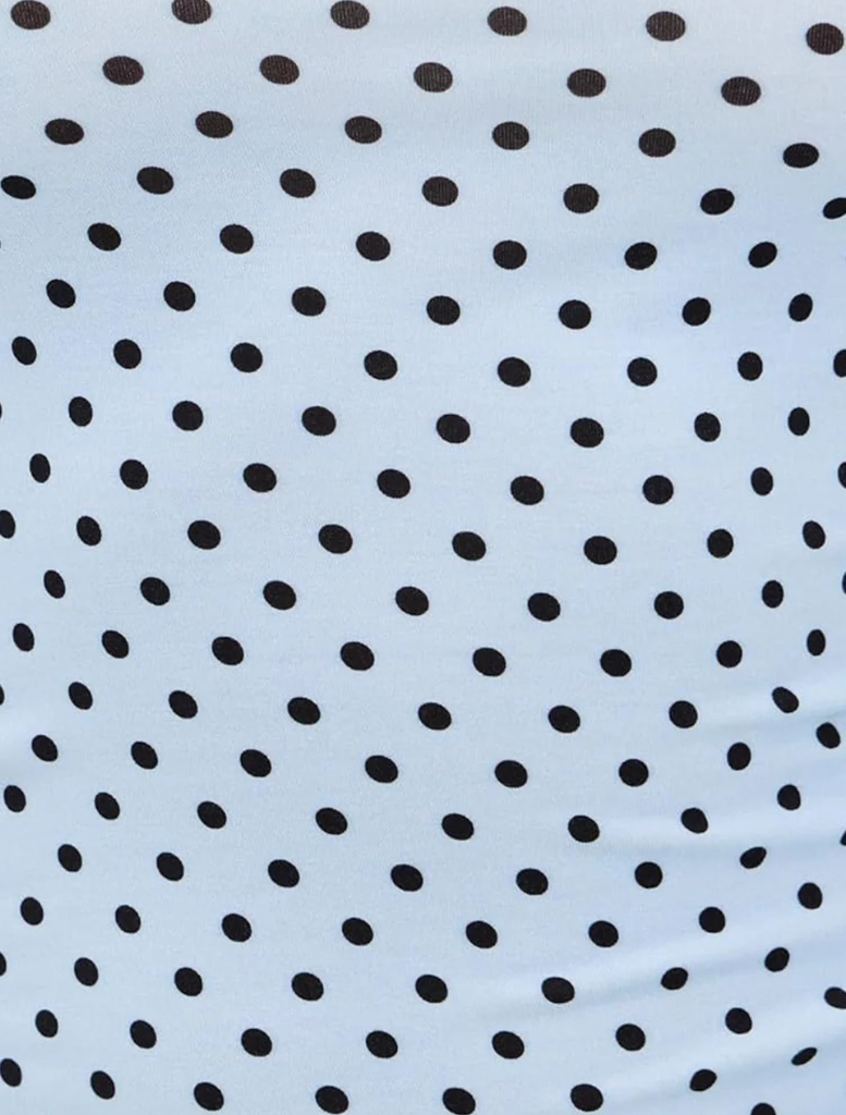 Amelia Top in blue with small white dots, featuring a stylish and modern design suitable for casual wear.