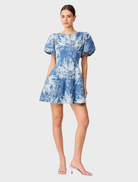 Elegant blue and ivory A-line mini dress with a fitted waist and flared hem, great for casual or dressy occasions.