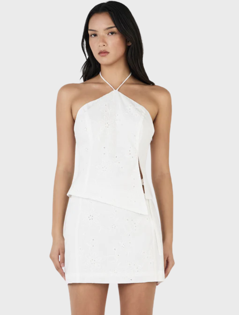 Chic white Anglaise halter top showcasing detailed embroidery, suitable for both casual and semi-formal events.