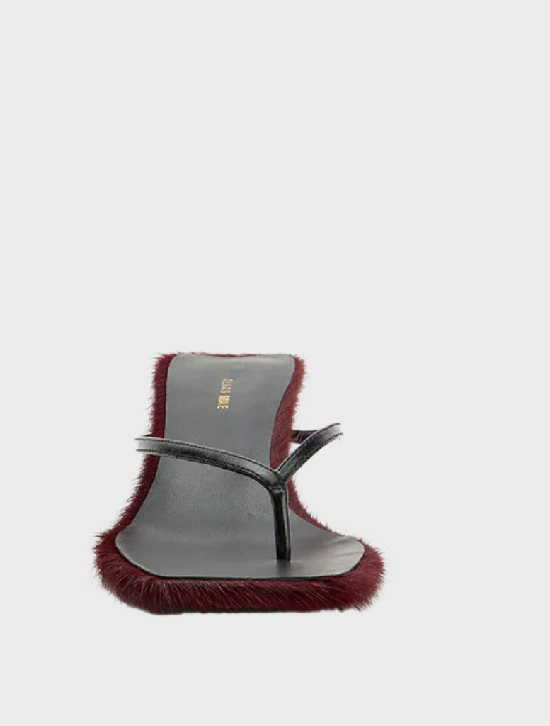 Chic black sandals with red fur trim, designated as Arli - Burgundy Pony.