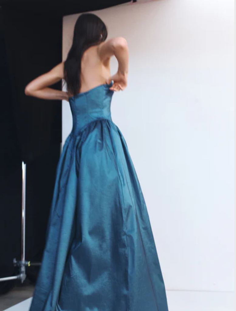 Stylish steel-colored Audrey gown, characterized by its elegant cut and luxurious fabric, perfect for formal events.