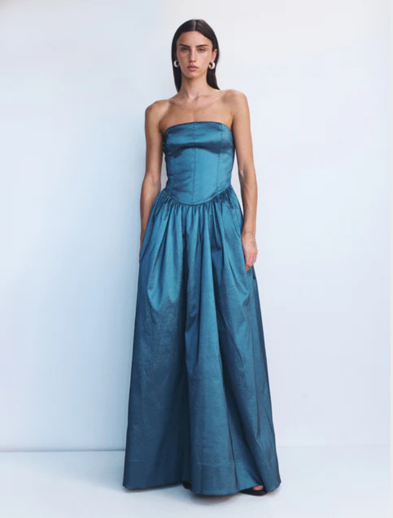 Elegant steel-colored Audrey gown with a flowing silhouette and intricate detailing, perfect for formal occasions.