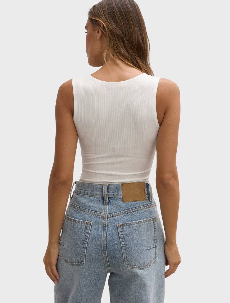 White bodysuit crafted from a soft, stretchy fabric, ideal for a comfortable and flattering fit.