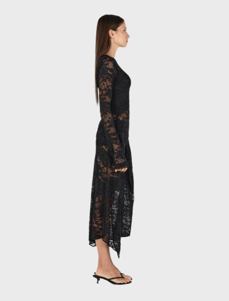 Sleek black Avery top presented on a hanger, emphasizing its modern cut and comfortable fabric.