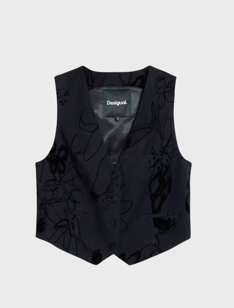 Black vest displayed on a hanger, featuring a sleek design and minimalistic style suitable for various occasions.