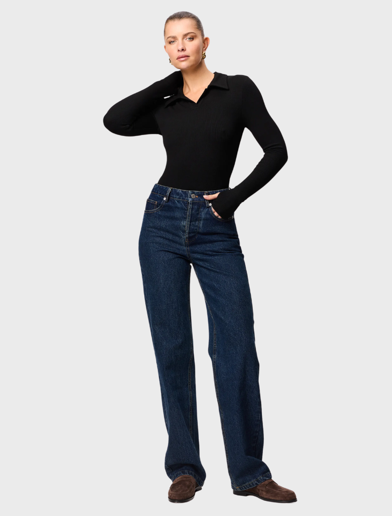 Florence black polo top with a timeless style, ideal for both casual outings and more polished looks.