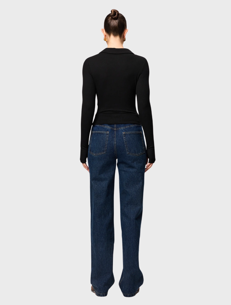 Elegant black polo top from Florence, designed for versatility and comfort, perfect for everyday wear.