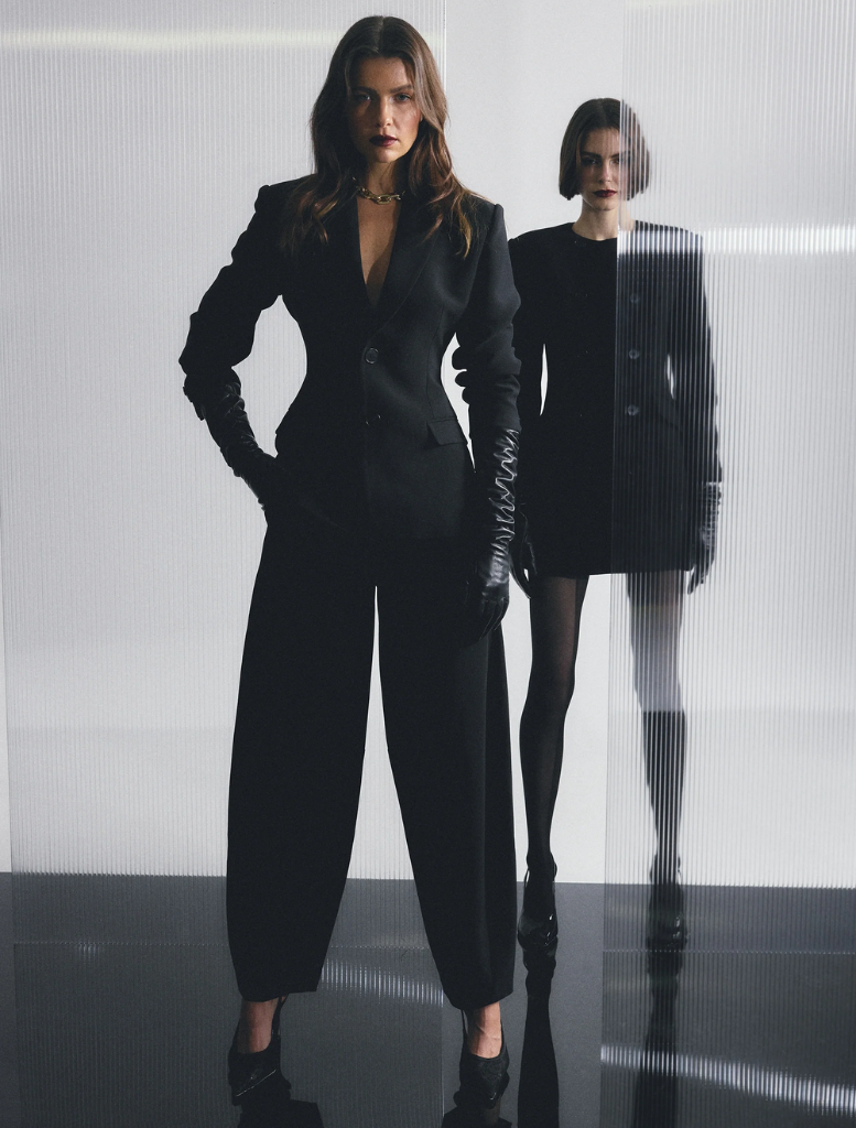 Elegant black Sonder Blazer on a hanger, showcasing a modern cut ideal for professional and formal settings.