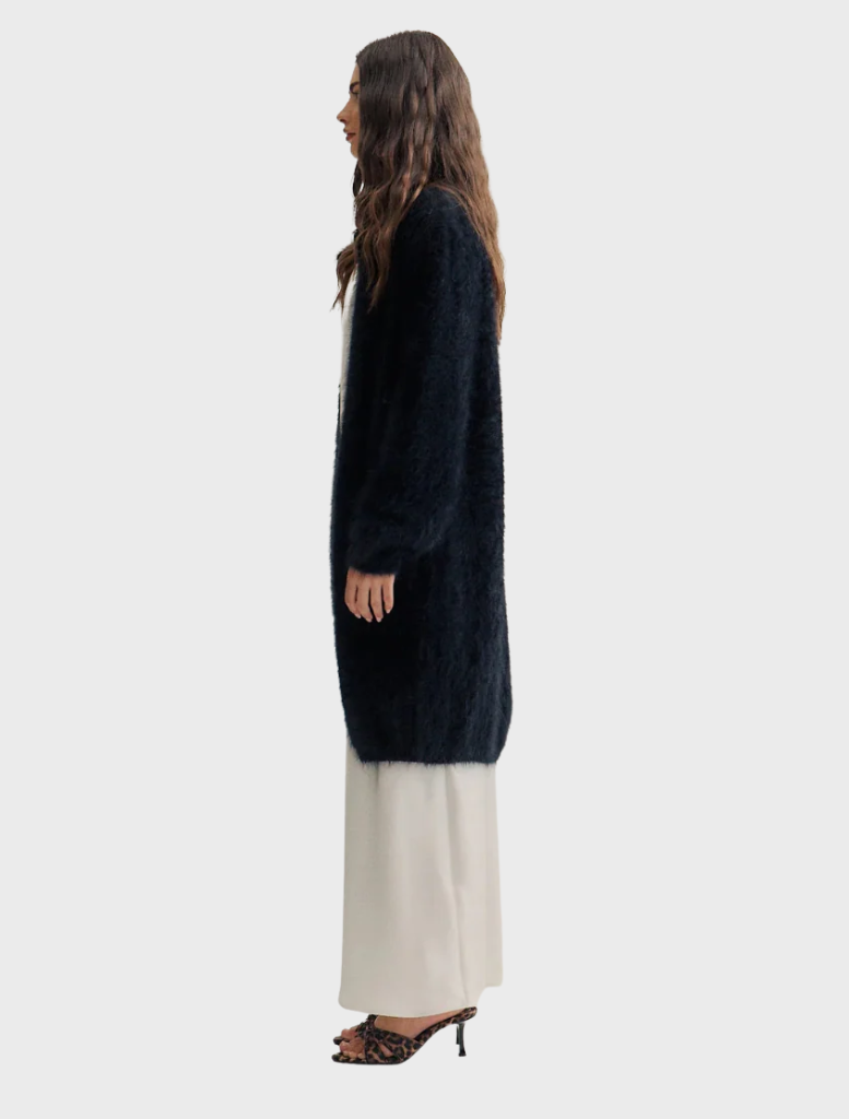 Elegant black cashmere cardigan by Sophia, featuring an open front and long sleeves, hanging against a neutral background.