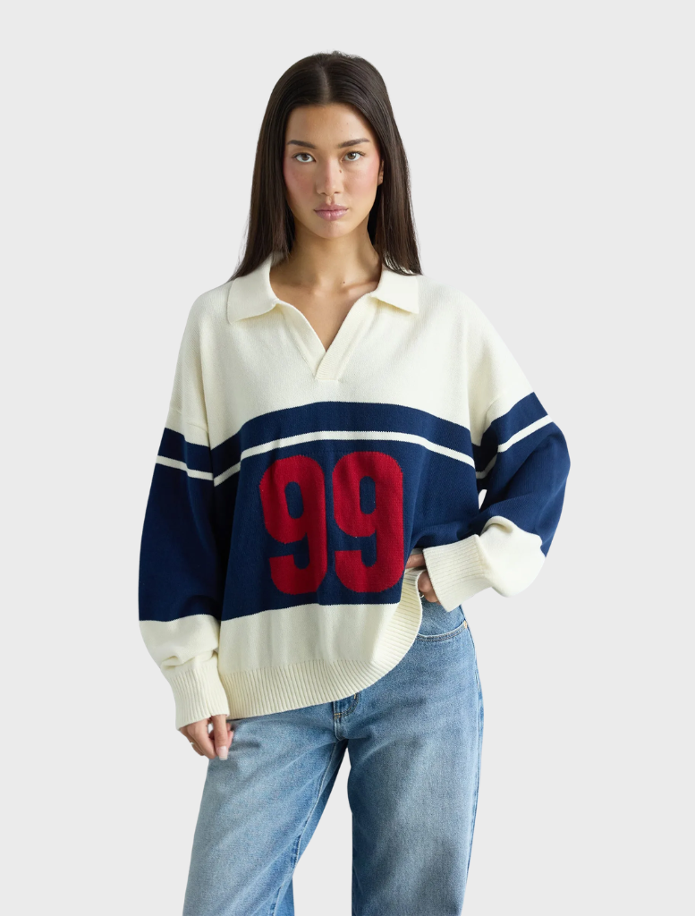 Stylish blue stripe rugby knit, showcasing a traditional pattern and cozy fabric.