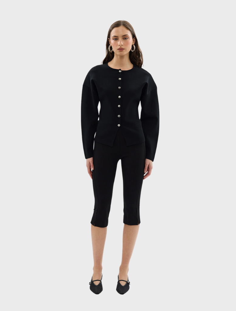 Close-up of a black Bronte knit cardigan, focusing on the knit pattern and open front style.
