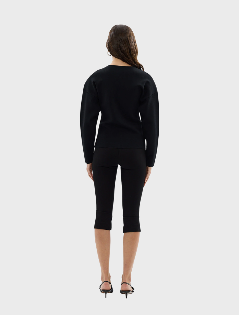 Close-up of a black Bronte knit cardigan, focusing on the knit pattern and open front style.