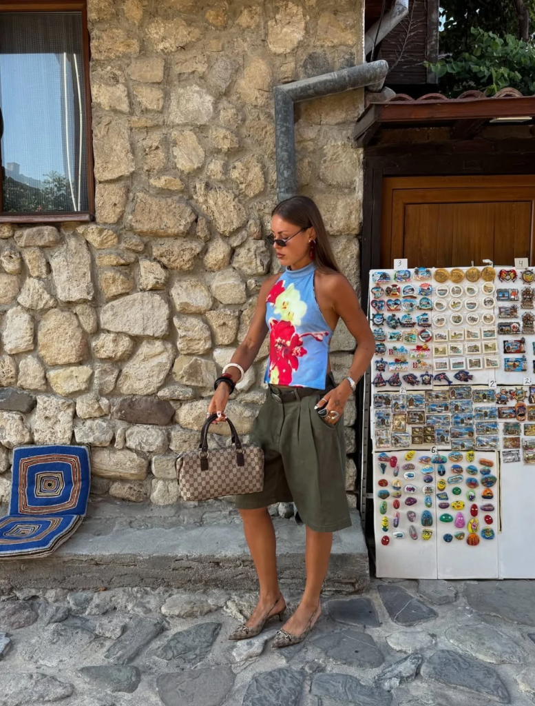 A Model wear blue top with beatuiful  floral pattern