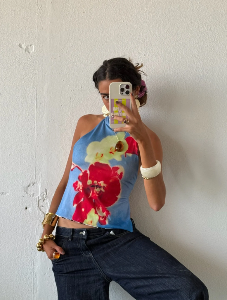 A  floral-patterned tops displayed side by side on a neutral background.