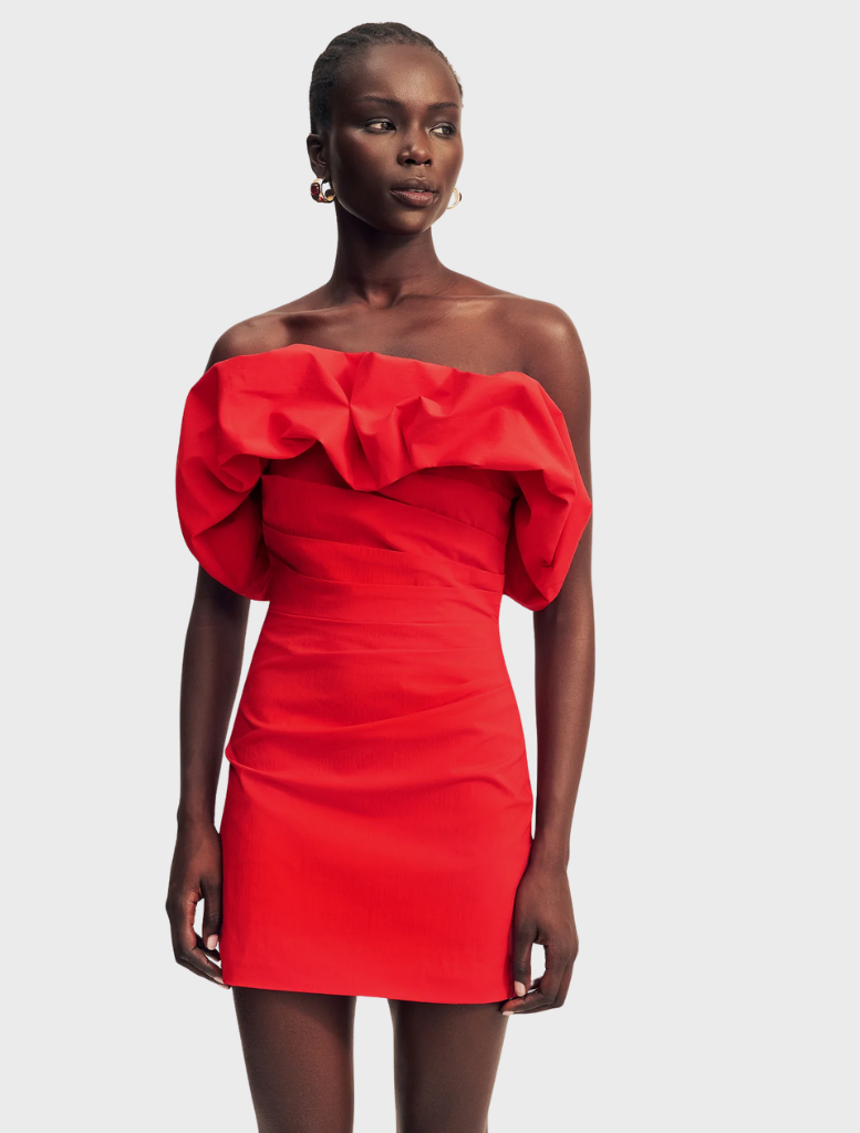 Vibrant goji strapless bubble mini dress, showcasing a fitted bodice and a flared skirt for a chic, playful appearance.
