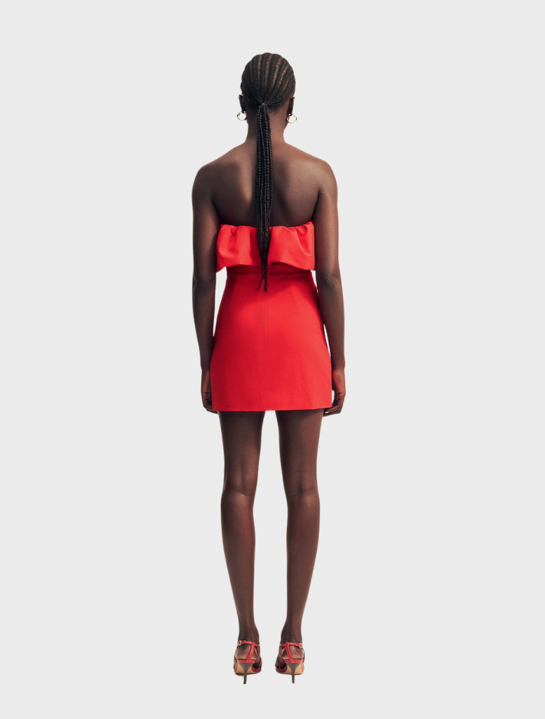 Strapless bubble mini dress in Goji color, featuring a fitted bodice and flared skirt for a playful, stylish look.
