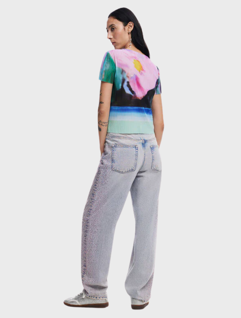 Medium wash denim Cara jeans laid out, emphasizing their timeless straight leg cut and casual appeal against a plain background.