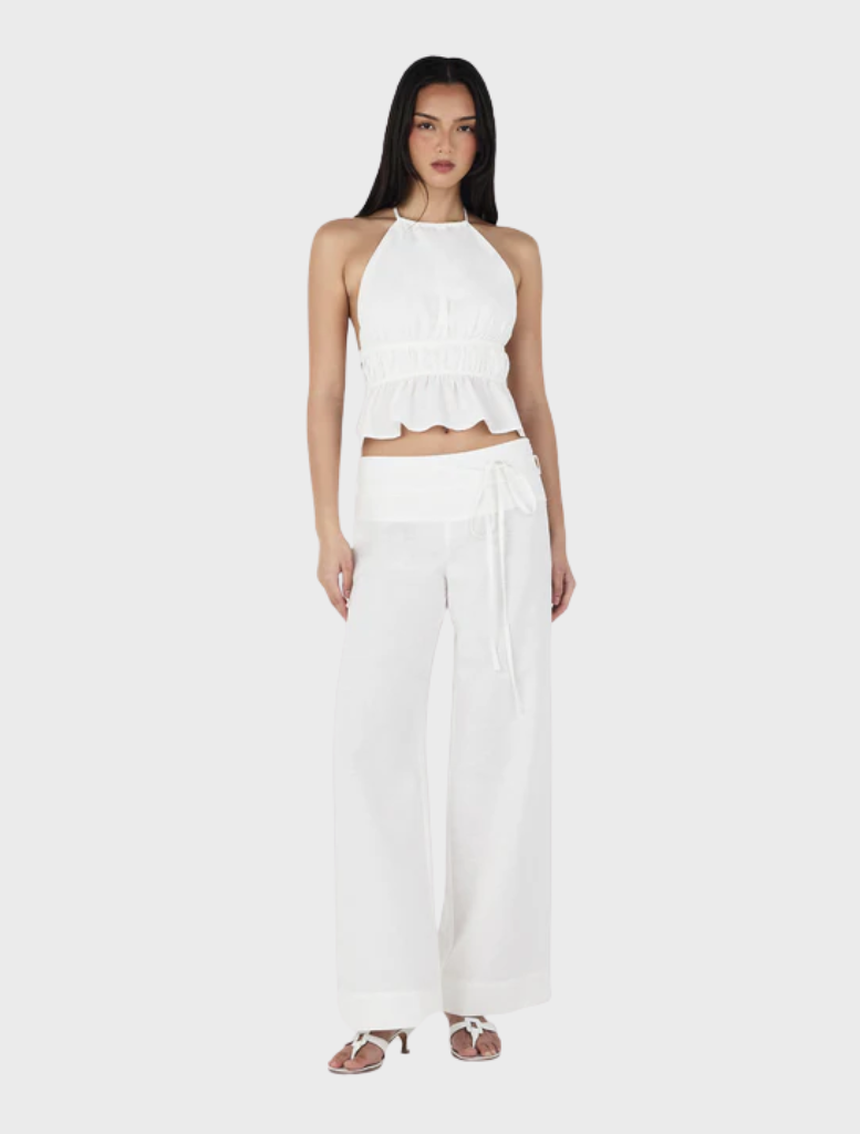 Casey pants in ivory color, featuring a contemporary cut, perfect for adding sophistication to any outfit.