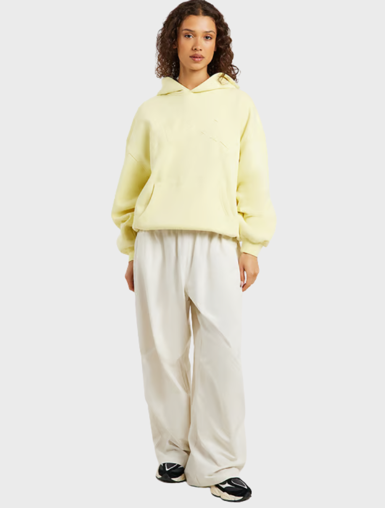 Oversized hoodie in celestial yellow, designed with drop shoulders, long sleeves, and a unique in-house graphic print.