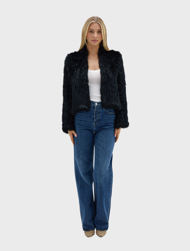 Black Emma Jacket showcased, featuring a refined look and tailored structure, ideal for versatile wardrobe styling.