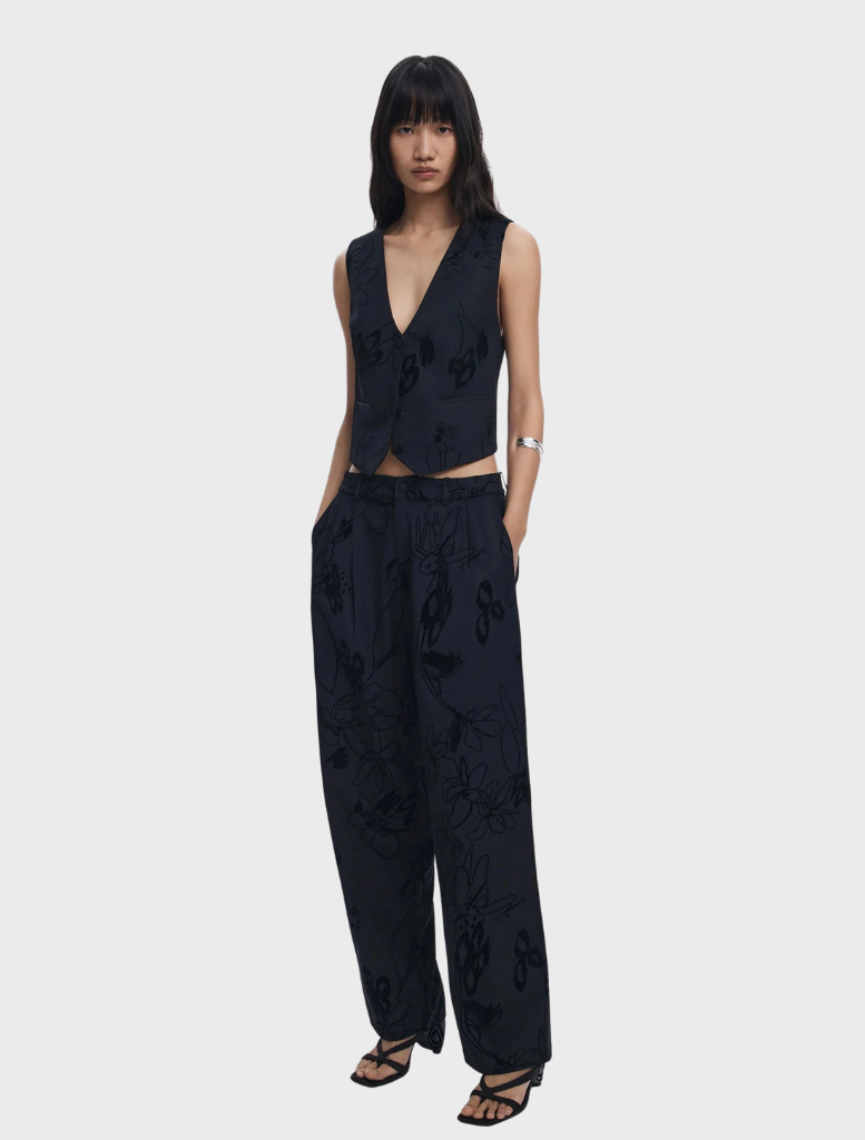 Black long trousers displayed on a white background, showcasing a sleek and modern design suitable for various occasions.