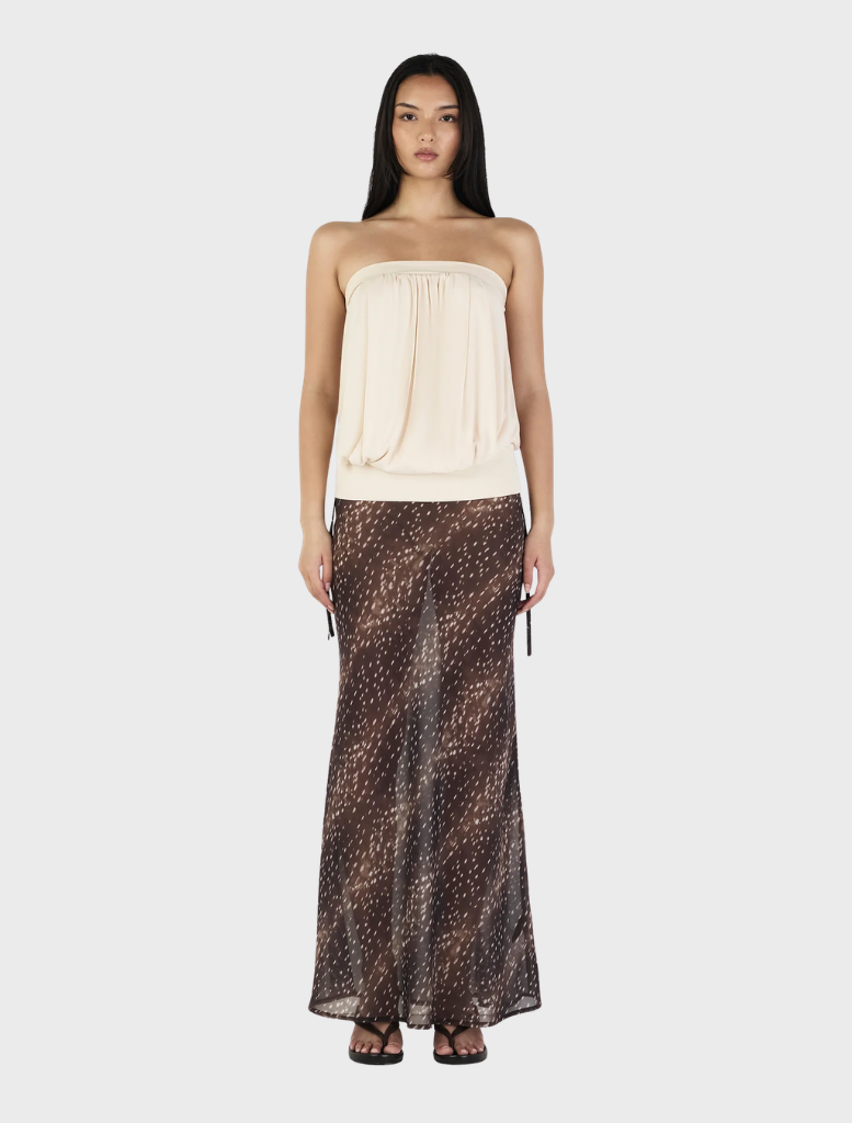 Cream ZOE top displayed, emphasizing its clean lines and soft texture, perfect for versatile styling.
