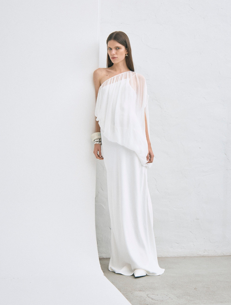 Stylish one-shoulder gown in a delicate cloud hue, designed for floor-length elegance at formal gatherings.