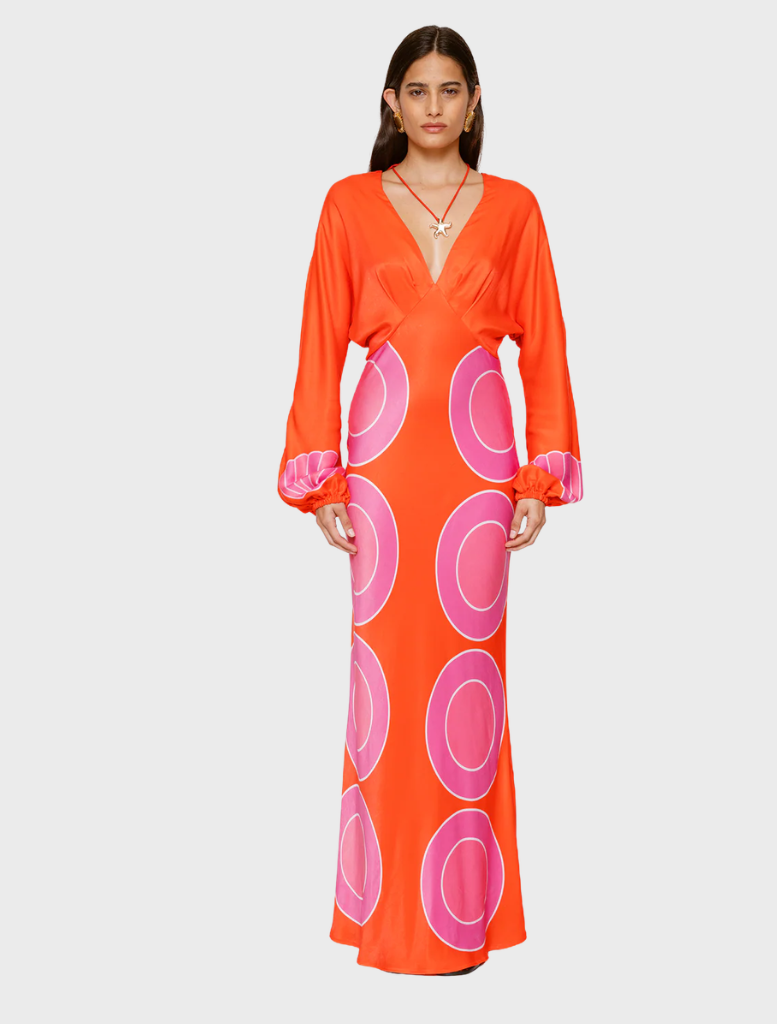 Orange long sleeve maxi dress with a flowing silhouette, perfect for casual or formal occasions.
