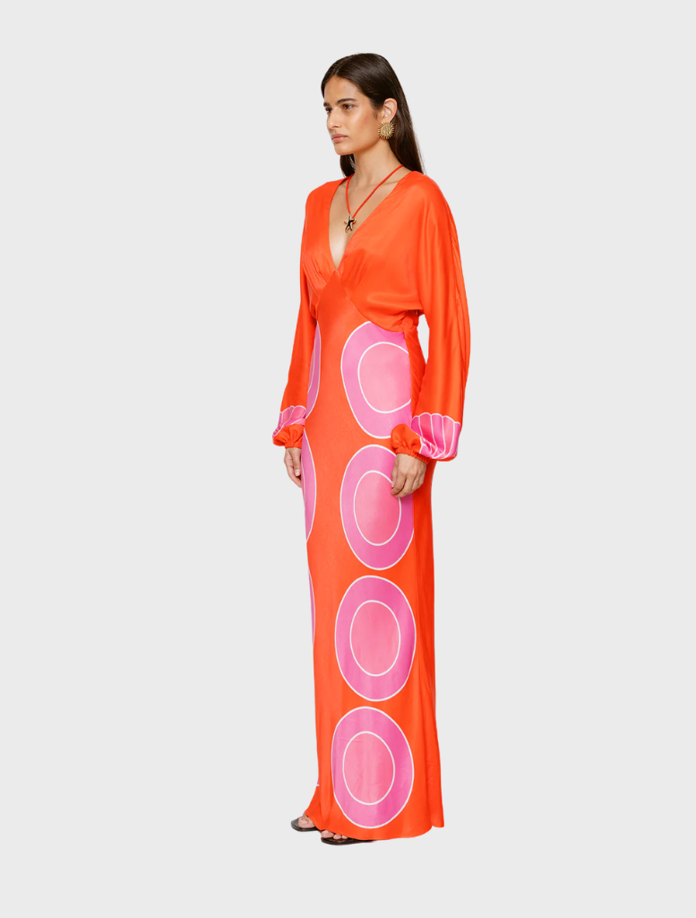 Vibrant orange maxi dress with long sleeves, offering a chic and comfortable look for any occasion.