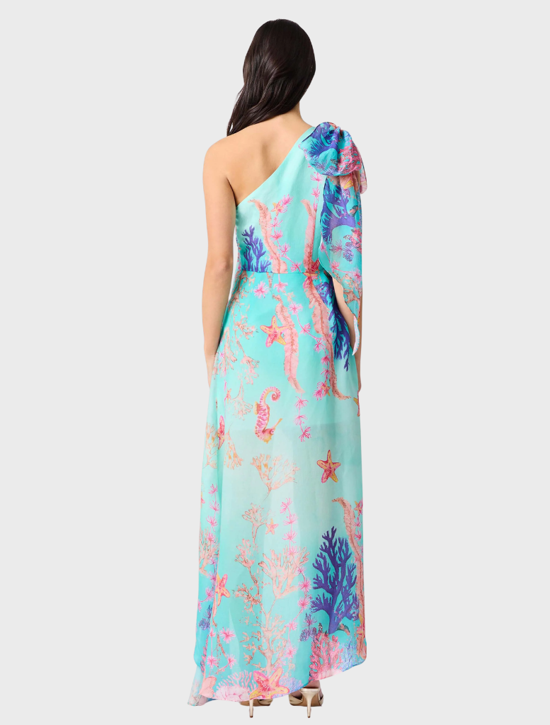 Elegant coral asymmetrical gown with a blue multi-color pattern, showcasing a stylish and modern design.
