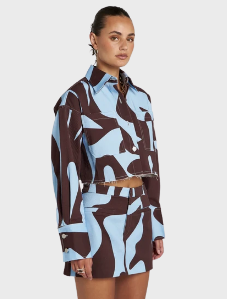 Relaxed Cropped Shacket showcasing hand-drawn Mirage artwork in earthy tones, ideal for seasonal layering and casual outings.