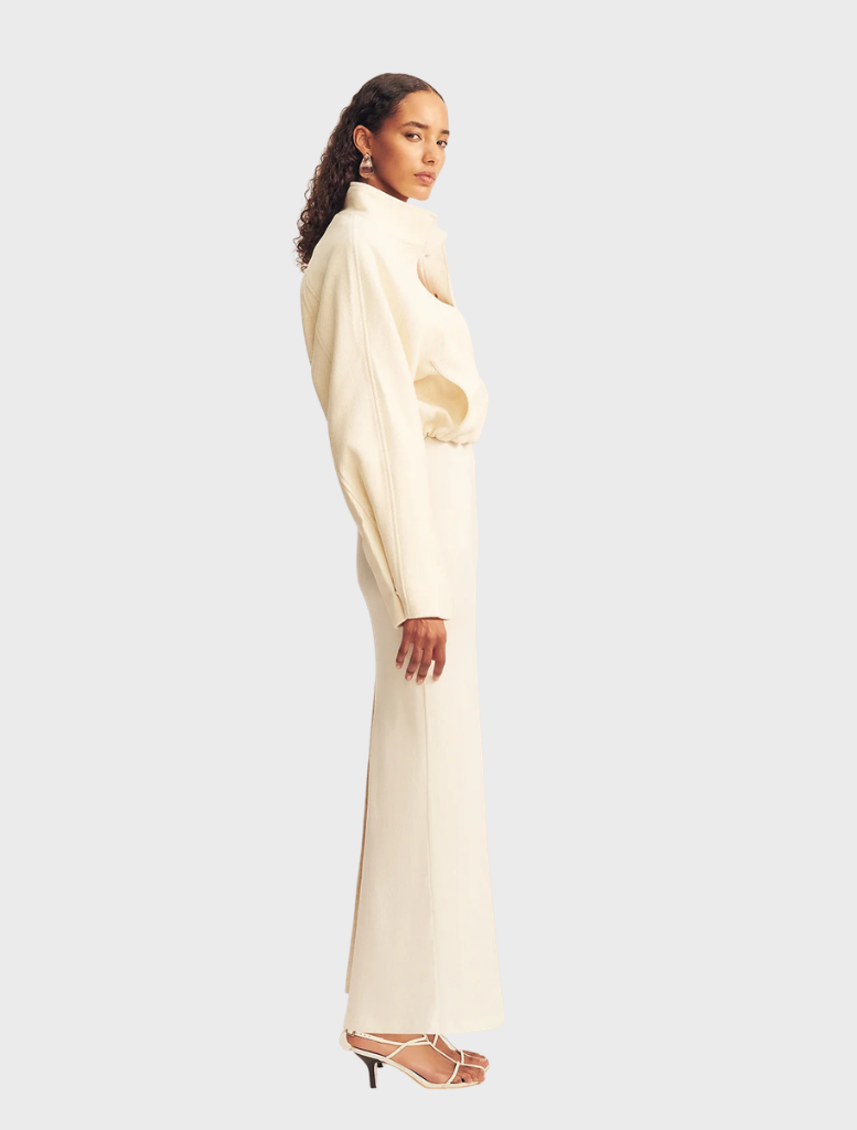 Fashionable ivory bomber jacket, cropped style with a zipper front and ribbed edges, perfect for layering.