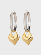 Two-tone heart hoop earrings featuring a stylish blend of colors and a modern design.