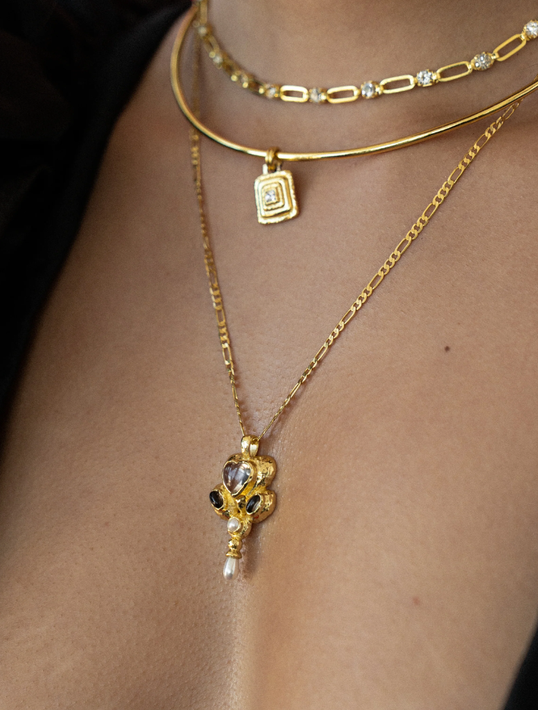 Elegant gold Diya necklace showcasing detailed artistry, ideal for enhancing any outfit.