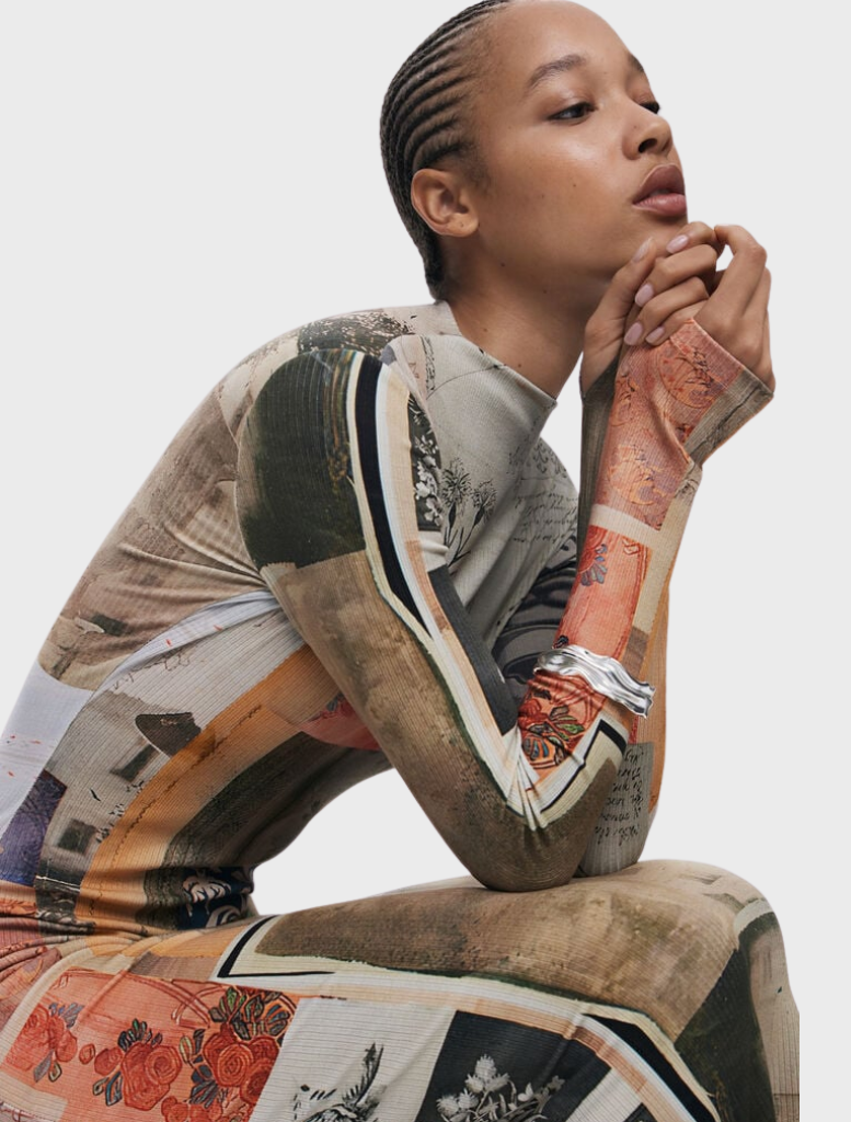 Stylish long-sleeved dress showcasing a unique, eye-catching arty print in a blend of vivid colors.