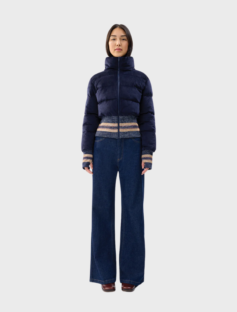 Navy Dublin jacket displayed on a hanger, featuring a sleek design and modern cut suitable for various occasions.