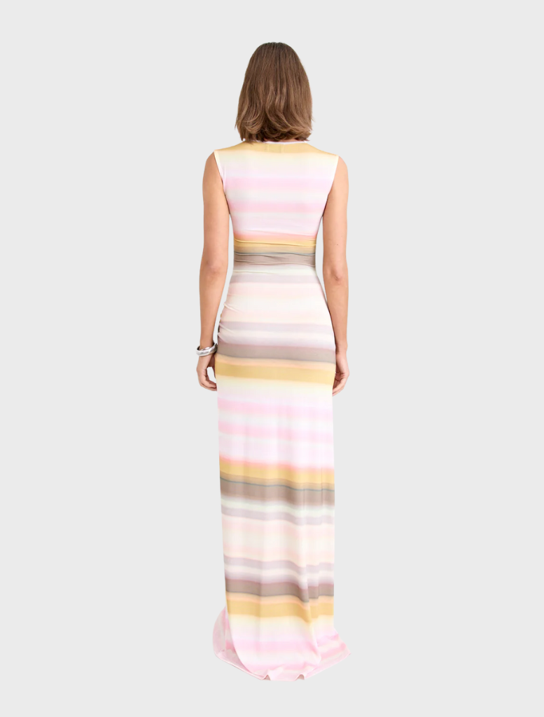 Peach Elara Gown, characterized by its elegant style and flowing lines, ideal for upscale occasions.