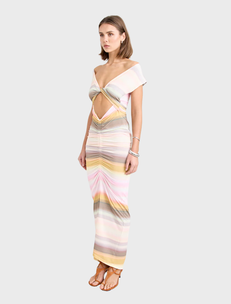 Peach Elara Dress showcasing a stylish, flowing design perfect for casual or formal events.