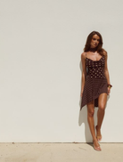 Alora mini dress with a scoop neckline, adorned with chocolate and lemon polka dots, perfect for a fun, stylish look.
