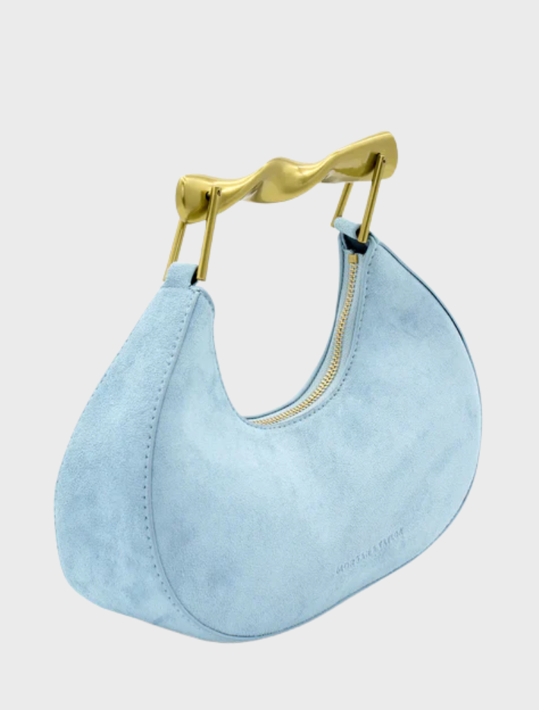 Pale blue Myla handbag with a sleek design, featuring a structured shape and elegant handles.