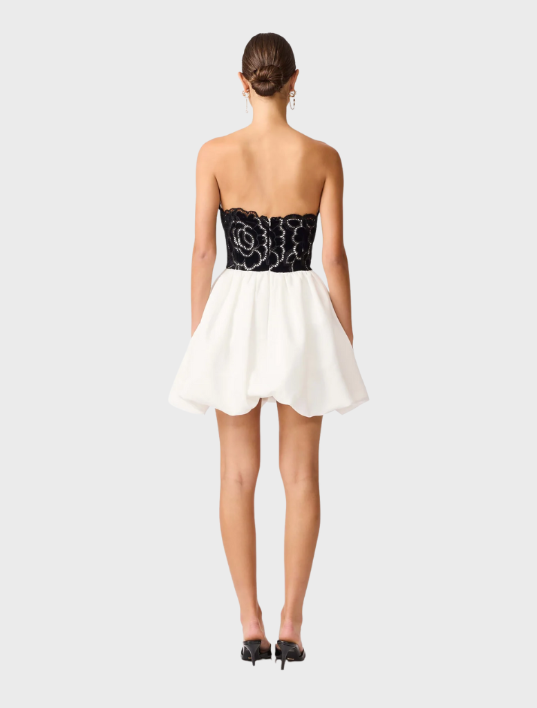 Modern black and white strapless mini dress with a tailored fit, ideal for a sophisticated and fashionable outfit.