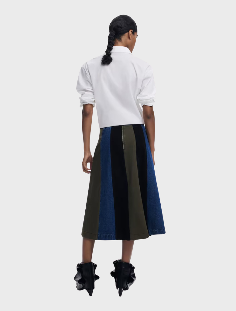 Evase skirt in a variety of colors, hanging elegantly to highlight its stylish and flowing silhouette.