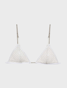 White bralette embellished with glitter, offering a chic and radiant fashion statement.