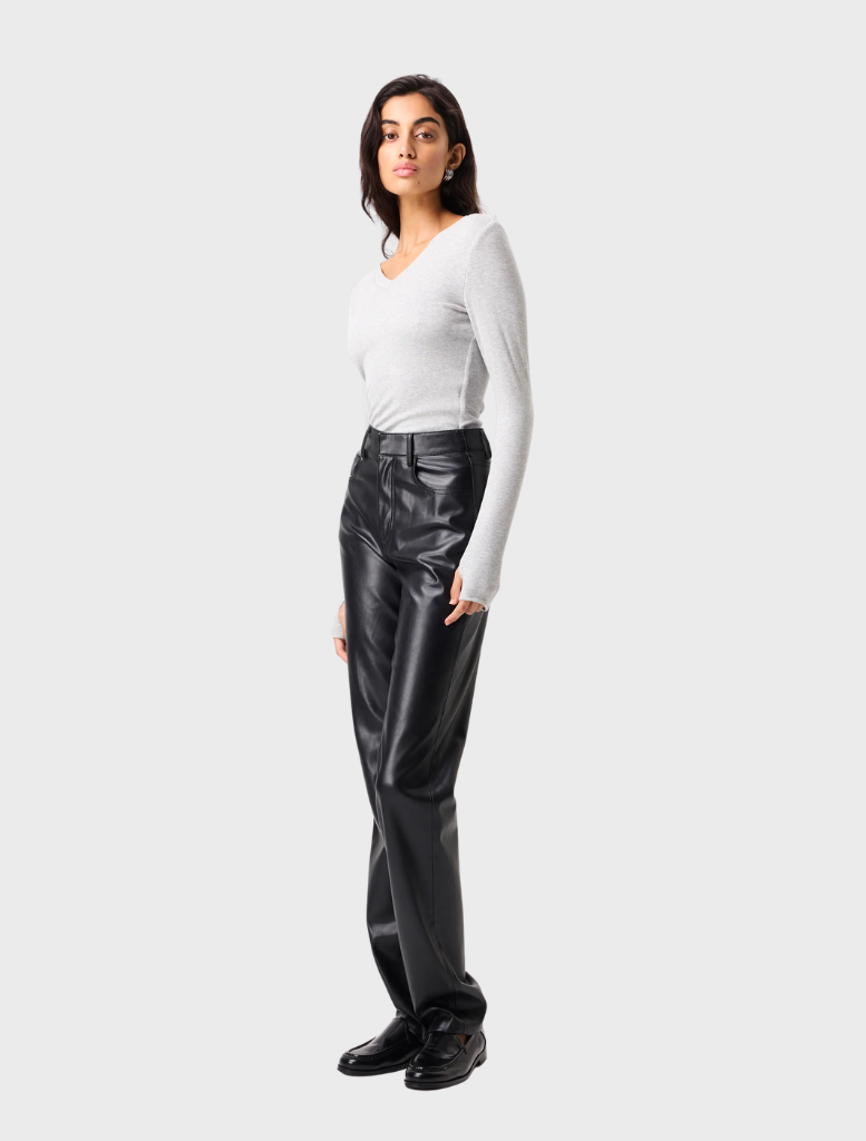 Black Fairfax Pant hanging on a hanger, emphasizing its clean lines and versatile look.