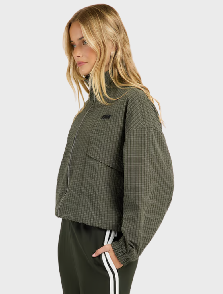 Relaxed-fit olive check jacket with a funnel neck, two-way zip closure, and angled pockets for modern layering.
