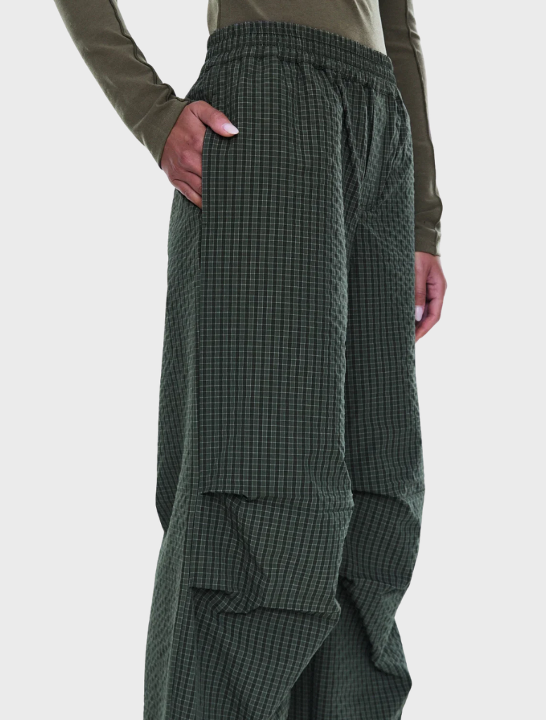 Relaxed olive check pull-on pant featuring a soft polyester blend, wide-leg design, and adjustable drawcord for comfort.