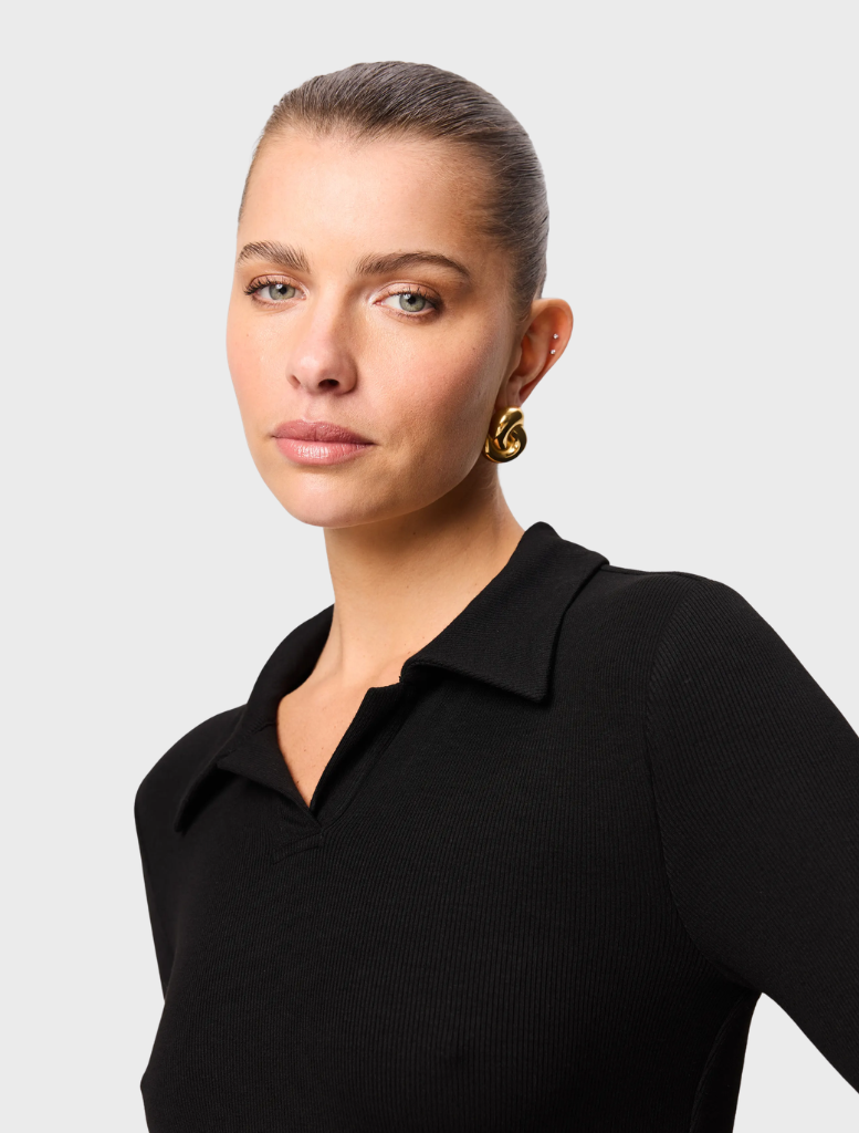 Classic black polo top by Florence, offering a stylish and comfortable option for various occasions.