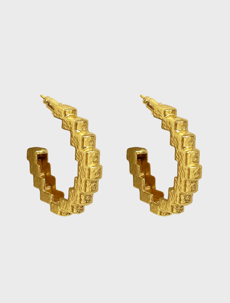 Elegant gold Gabrielle earrings featuring a modern design, perfect for formal or casual occasions.
